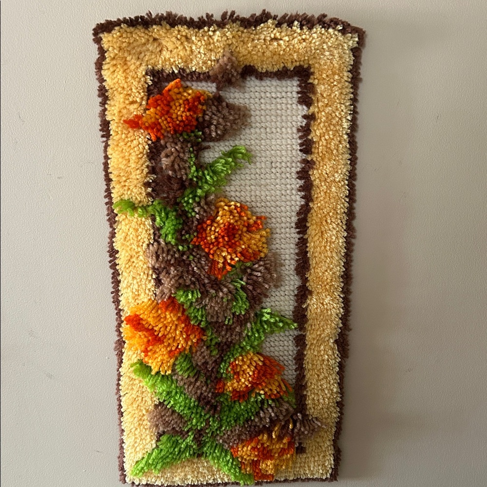 Vintage 1970’s handmade floral 23 x11 latch-hook wall hanging by Spinrite